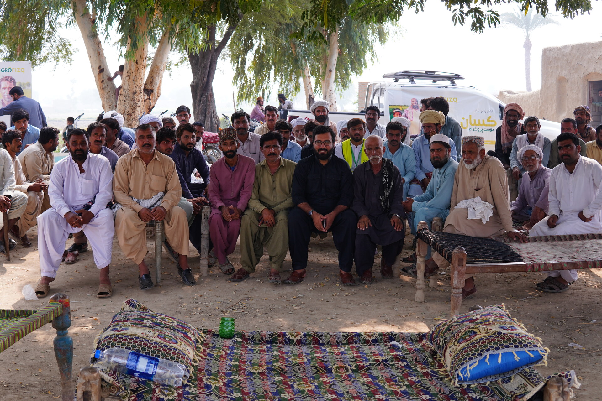 Smallholder farmers gathering with GroRizq Kisan Dost Program field operations team